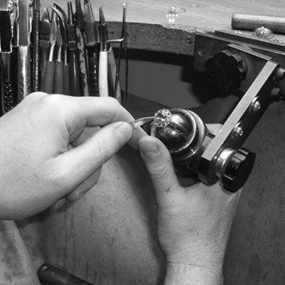 Jewellery maker at work detailing a ring