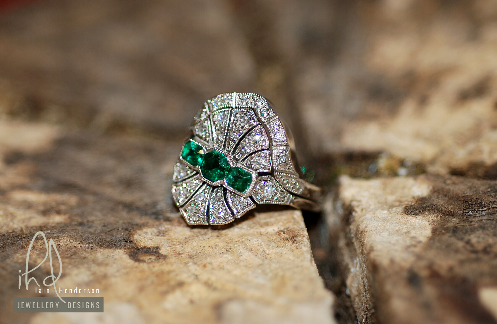 Bespoke art deco style engagement ring with diamonds and emeralds, and a shaped to fit wedding ring