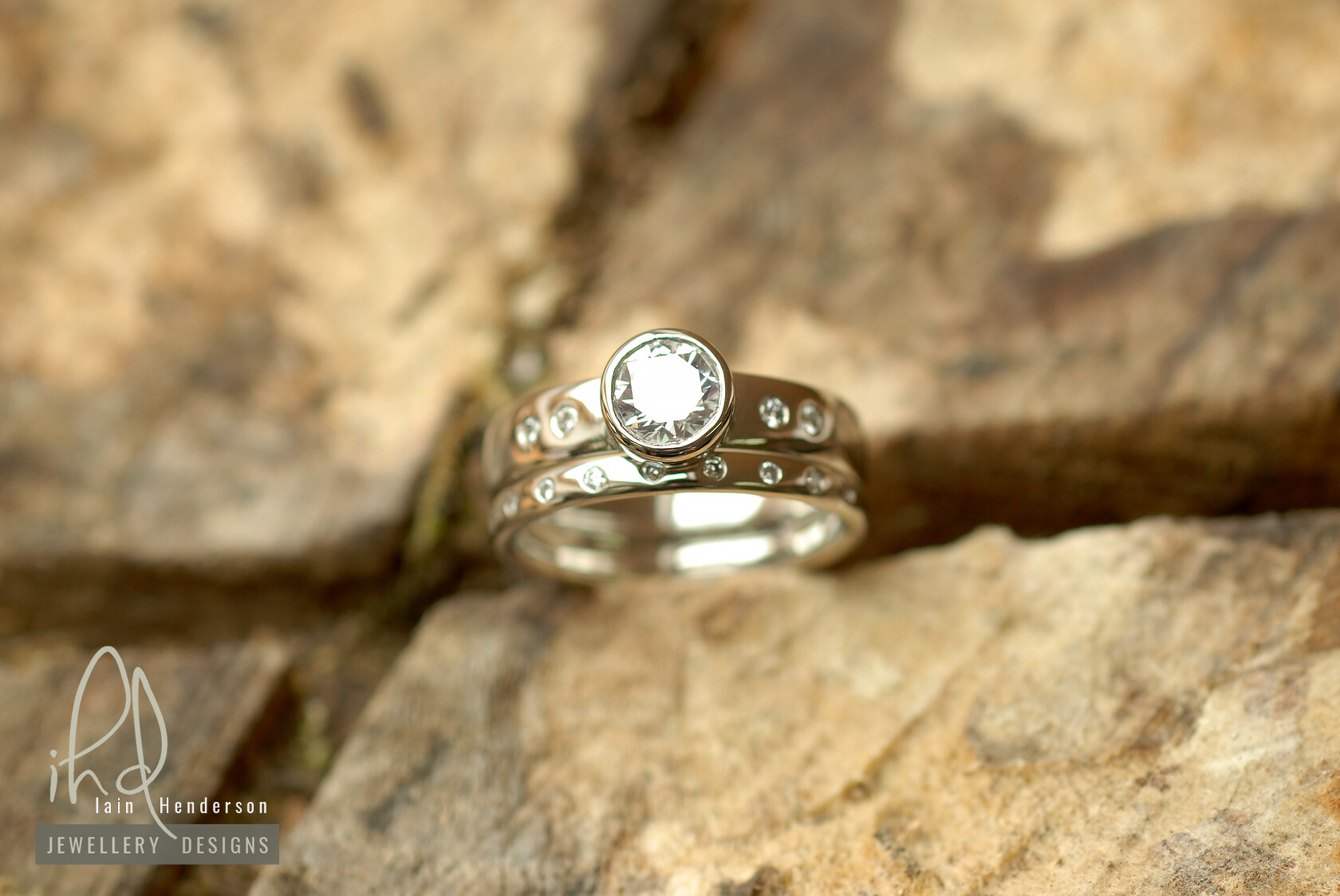 Engagement and wedding ring set with small white diamonds on both bands