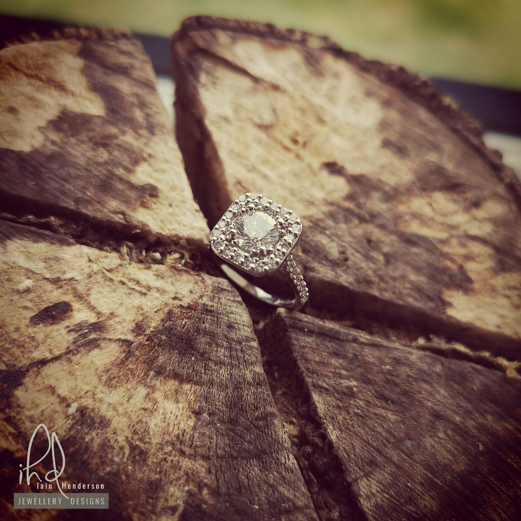 Cushion halo style engagement ring with diamonds on the shoulders 
 dav